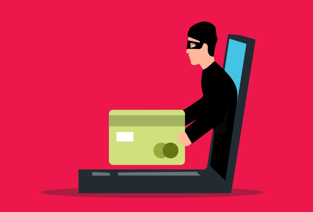 A hacker stealing a credit card through a laptop inside a red background